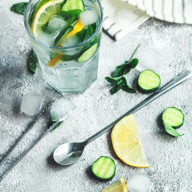 A 5-step integrated summer skincare and nutrition routine featuring wooden-capped bottles of cleanser, toner, serum, moisturizer, and SPF 50, styled with fresh fruit and hydration.