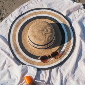 Applying SPF 50 sunscreen for maximum summer skin protection and a healthy glow.
