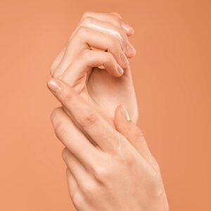 Applying lightweight moisturizer for a hydrated summer skin glow