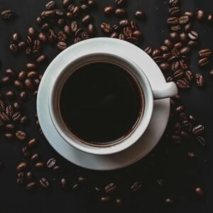 Best morning drinks for weight loss with black coffee and roasted coffee beans on wooden table