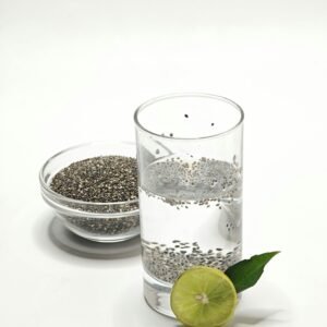 Best morning drinks for weight loss with chia seed water and fresh lemon on white background