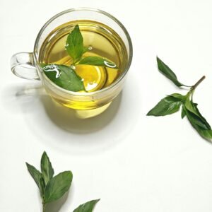 Best morning drinks for weight loss with fresh green tea and mint leaves in glass cup